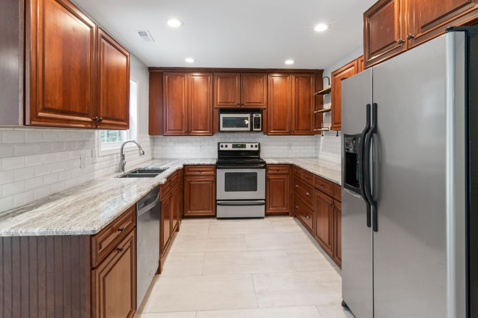 Remodeled home interior with cabinets and natural light