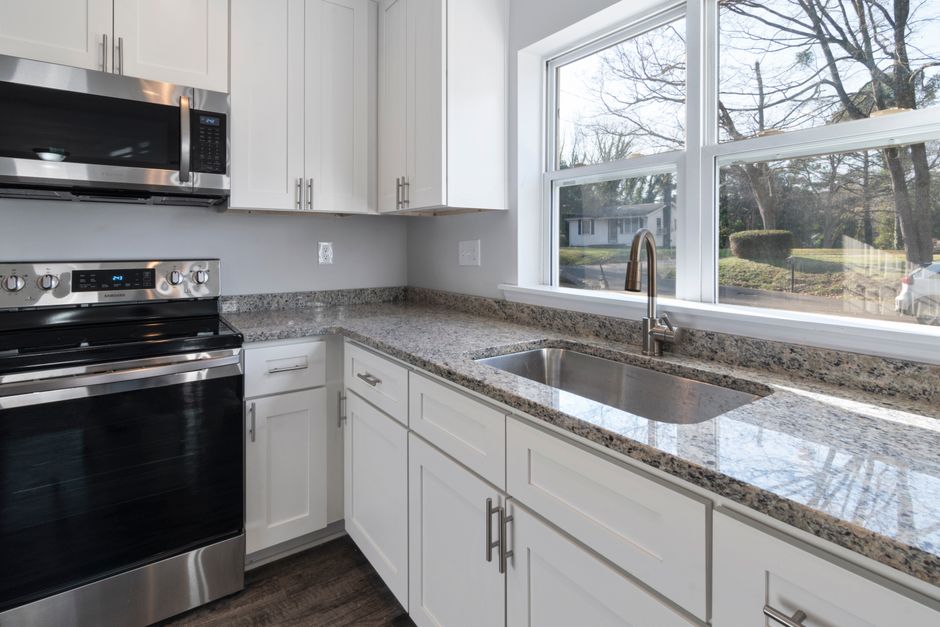 Remodeled home interior with cabinets and natural light