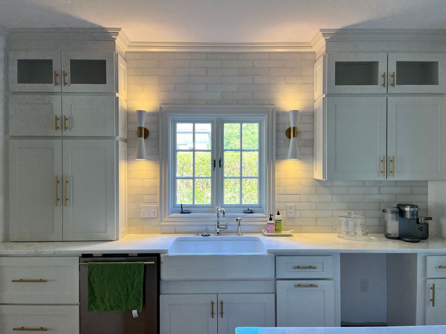 Remodeled home interior with cabinets and natural light