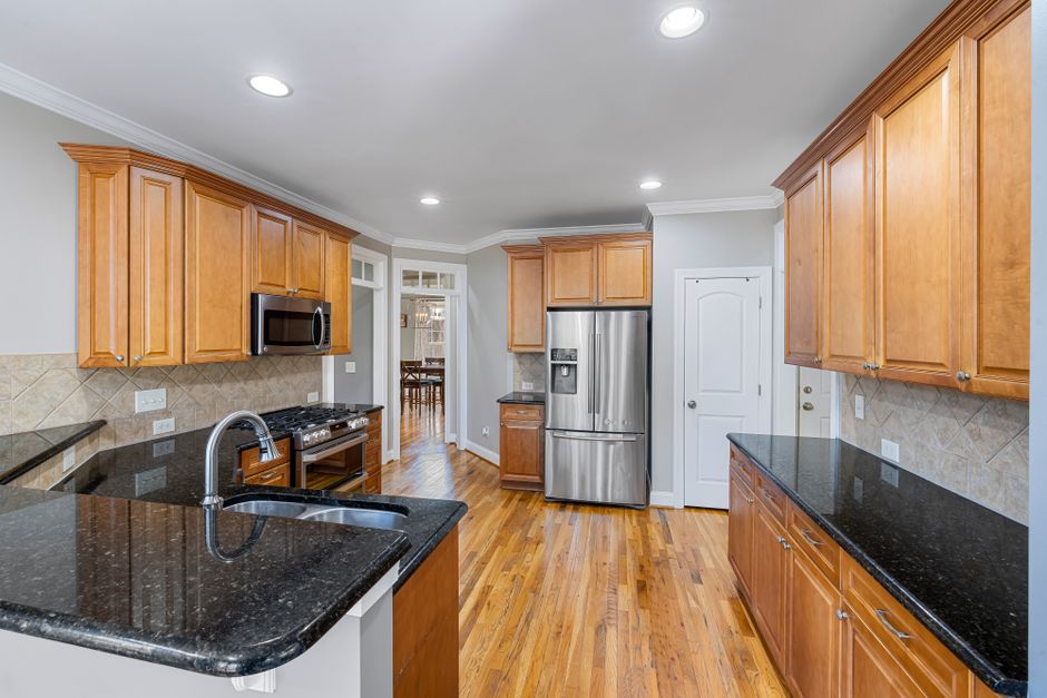 Remodeled home interior with cabinets and natural light