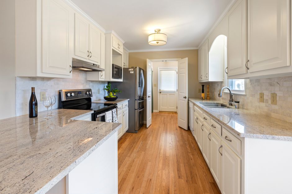 Remodeled home interior with cabinets and natural light